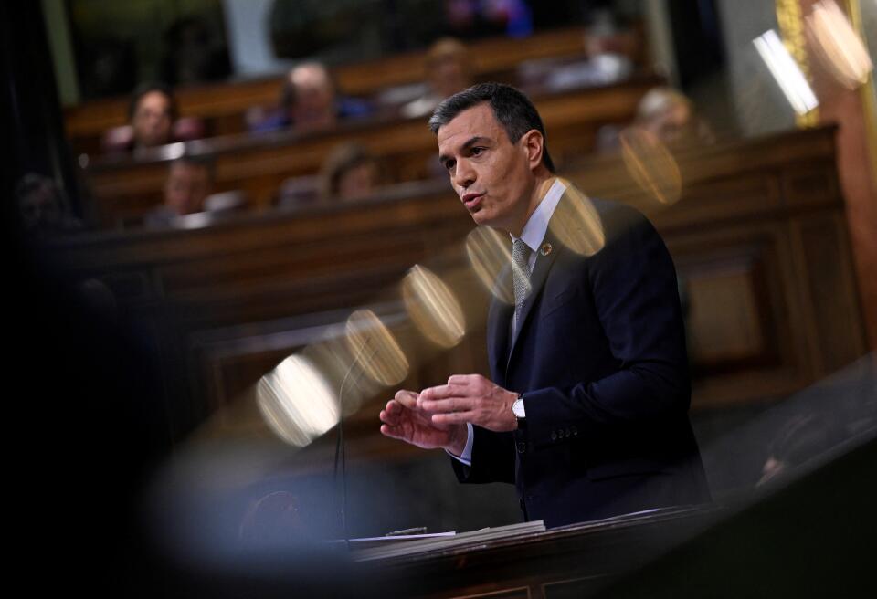 Spain's Prime Minister Pedro Sanchez delivers a speech during the parliamentary debate on the State of the Nation, at the Congress of Deputies in Madrid on July 12, 2022. (Photo by PIERRE-PHILIPPE MARCOU / AFP)