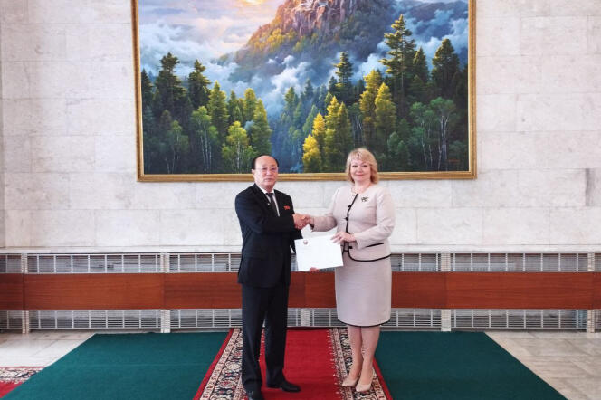 Olga Makeyeva, ambassador of the self-proclaimed Donetsk People's Republic (DNR) to Russia, receives a letter of recognition from North Korea's ambassador to Russia, Sin Hong-chol, at the DNR embassy in Moscow on July 13