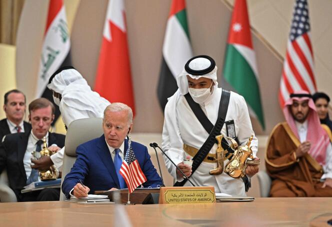 U.S. President Joe Biden takes notes during the Security and Development Summit in Saudi Arabia's city of Jeddah on July 16, 2022.