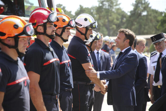 Emmanuel Macron meets firefighters at field command post in La Test-de-Buch. 