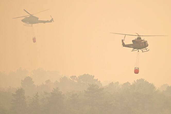 Slovenia’s Army helicopters help to extinguish wildfires close to the village of Kostanjevica na Krasu, on July 20, 2022.