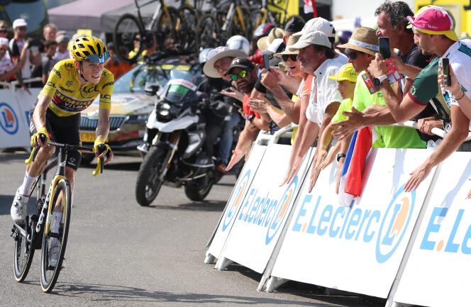 Jumbo-Visma team's Danish rider Jonas Vingegaard wearing the overall leader's yellow jersey cycles in the final kilometers to win the 18th stage of the Tour de France cycling race on July 21, 2022.