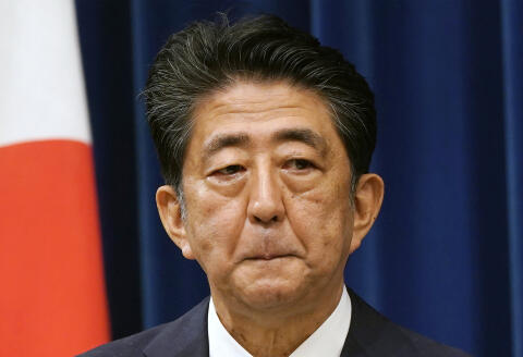 FILE - Japanese Prime Minister Shinzo Abe reacts during a press conference at the prime minister official residence in Tokyo on Aug. 28, 2020. Japan's Cabinet on Friday, July 22, 2022 formally decided to hold a state funeral on Sept. 27 for the assassinated former Prime Minister Abe, amid national debate over the plan which some criticize an attempt to glorify a divisive political figure. (Franck Robichon/Pool Photo via AP, File)