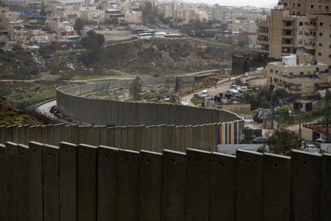 The Israeli settlement of Pisgat Zeev, built in a suburb of the mostly Arab east Jerusalem, and the Palestinian Shuafat refugee camp, behind Israel's controversial separation wall