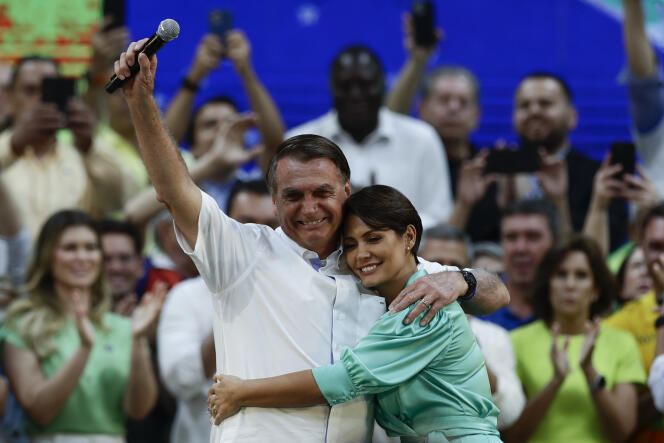 President Jair Bolsonaro embraces his wife, Michelle, during the launch of his campaign for the Brazilian presidential election, July 24, 2022 in Rio de Janeiro.