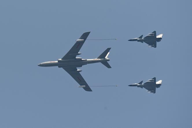 A tanker and two J-10 fighter jets fly over Beijing, during the October 1 military parade in 2019.