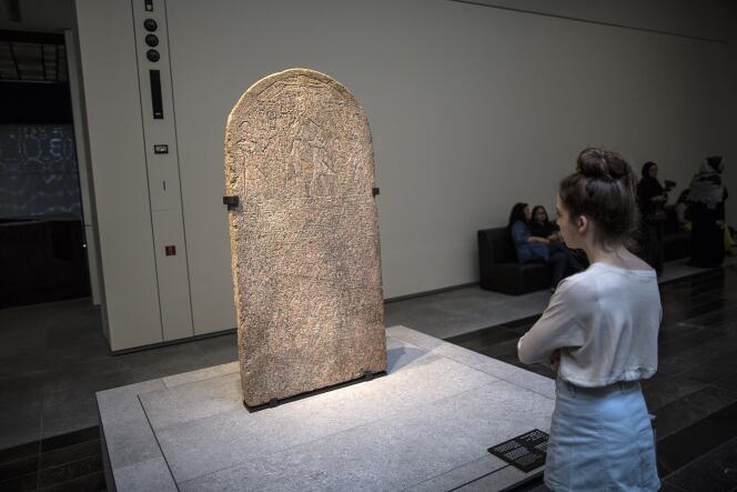 A pink granite stele engraved with the name of Pharaoh Tutankhamun, which may have been looted. On display at the Louvre Abu Dhabi, November 11, 2017.