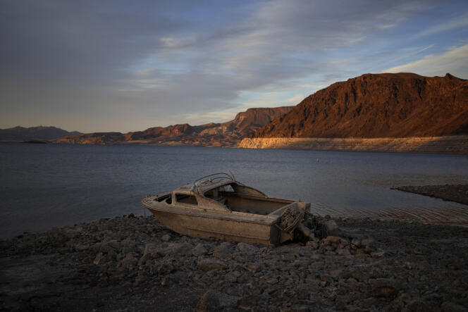 A formerly sunken boat sits high and dry along the shoreline of Lake Mead, where the remains of three bodies have been found this year.
