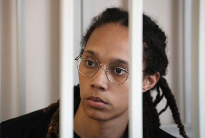 WNBA star and two-time Olympic gold medalist Brittney Griner sits in a cage in a courtroom prior to a hearing, in Khimki just outside Moscow, Russia, Wednesday, July 27, 2022. 
