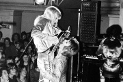 On June 17, 1972, during a concert in Oxford, David Bowie clings to the pelvis of guitarist Mick Ronson and simulates fellatio.
