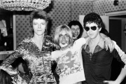 David Bowie, Iggy Pop and Lou Reed at the Dorchester Hotel in London on July 16, 1972. In the background is Tony Defries, Bowie's manager.  