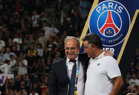 Luis Campos (L), Portuguese Football Advisor for French club Paris Saint-Germain, celebrates with Paris Saint-Germain's French head coach Christophe Galtier after the team won the French Champions' Trophy (Trophee des Champions) final football match, Paris Saint-Germain versus FC Nantes, in the at the Bloomfield Stadium, in Tel Aviv on July 31, 2022. Paris Saint-Germain (PSG) beat Nantes 4-0 to clinch the trophy. (Photo by JACK GUEZ / AFP)