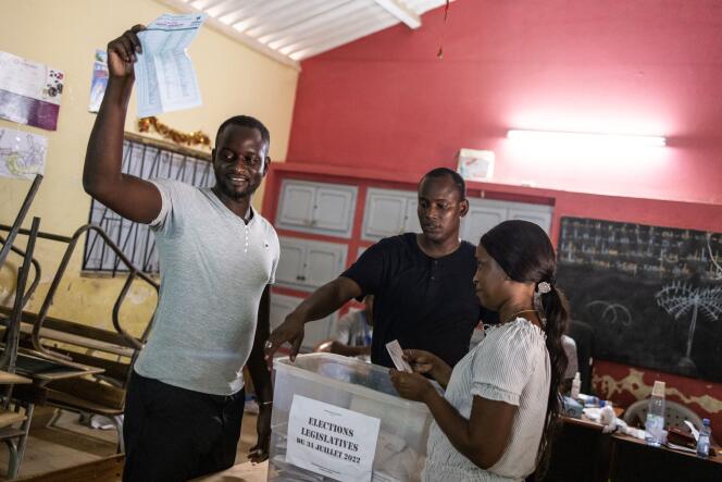 Election officials count the ballots at the end of the voting day in the popular neighbourhood of Ngor in Dakar on July 31, 2022.  
