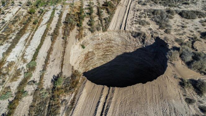 Aerial view taken on August 1, 2022, showing a large sinkhole that appeared over the weekend near the mining town of Tierra Amarilla, Copiapo Province, in the Atacama Desert in Chile. 