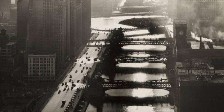 Smoggy aerial view of five drawbridges spanning the Chicago River, with traffic and warehouses on its banks, Chicago, Illinois, 1940s.   (Photo by Fred G Korth/Getty Images)