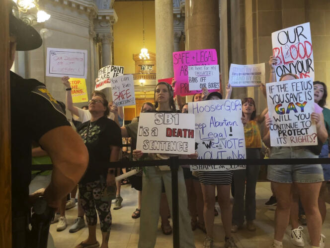 Abortion-rights protesters fill Indiana Statehouse corridors and cheer outside legislative chambers, on August 5, 2022, as lawmakers vote to concur on a near-total abortion ban, in Indianapolis.