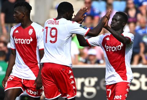 Monaco’s Senegalese midfielder Krepin Diatta (R) celebrates scoring the opening goal with his teammate Monaco's French midfielder Youssouf Fofana (C) during the French L1 football match between RC Strasbourg Alsace and AS Monaco at Stade de la Meinau in Strasbourg, eastern France on August 6, 2022. (Photo by SEBASTIEN BOZON / AFP)