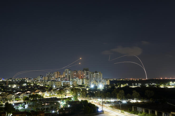 Israel's Iron Dome anti-missile system fires to intercept rockets launched from the Gaza Strip towards Israel just before a cease-fire between Palestinians and Israel takes effect, in Ashkelon, southern Israel, Sunday, Aug. 7, 2022. 