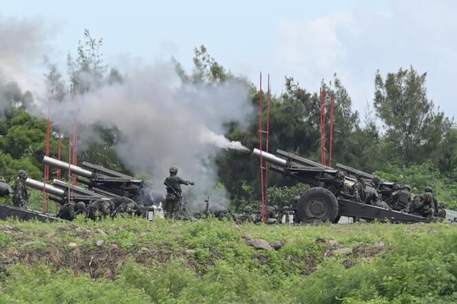 Taiwanese soldiers use artillery guns in the south of the island on August 9, 2022.