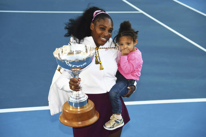 Serena Williams holds her daughter Alexis Olympia Ohanian Jr., and the ASB trophy after winning her singles finals match against Jessica Pegula at the ASB Classic in Auckland, New Zealand, Sunday, Jan 12, 2020.