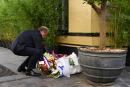 French Justice Minister Eric Dupond-Moretti lays a bunch of flowers at the site of the so called "Rue des Rosiers" or "Chez Jo Goldenberg restaurant" attack, a bombing and shooting attack on a Jewish restaurant during a ceremony marking its 40th anniversary of in Paris, on August 9, 2022. The August 9, 1982 attack is attributed to Abu Nidal Organisation - Fatah Revolutionary Council (Fatah-RC), a Palestinian group dissident from the Palestine Liberation Organisation (PLO). (Photo by Emmanuel DUNAND / AFP)