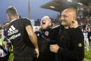 Ajaccio's French coach Olivier Pantaloni (R) and staff celebrate after victory in the last L2 football match of the 2022 season between Ajaccio (ACA) and Toulouse (TFC) at The Francois Coty Stadium in Ajaccio on May 14, 2022, on the French Mediterranean island of Corsica. - AC Ajaccio secured their place in Ligue 1 by beating fellow promoted Ligue 2 champions Toulouse 1-0 at the sold-out Francois Coty stadium in the 38th and final round. (Photo by Pascal POCHARD-CASABIANCA / AFP)