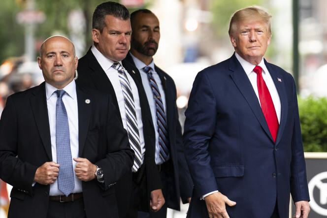 Former President Donald Trump (R) departs Trump Tower in New York City on August 10, 2022 to join the New York Attorney General's Office.