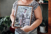 Svitlana Kryvytska holds a portrait of her husband Aleksander, a Russian prisoner since the end of February. Vylkove, Ukraine, August 04, 2022.