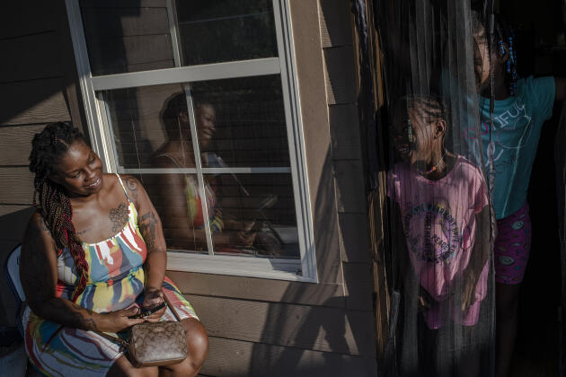Cherisse Jones at her home with two of her daughters in Jackson, Mississippi on July 14, 2022. The young woman became pregnant at age 12 and her mother took her to the Jackson Women's Health Organization for an abortion. She only remembers people outside yelling at her, pulling her arms and praying out loud. She now has five children.