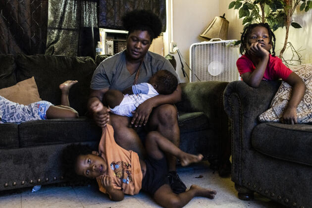 Tatyana Luis with her four children in the small house where she lives with her mother and disabled grandmother in Rolling Fork, Mississippi, July 13, 2022. She is now taking online classes to become a childcare worker.