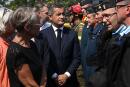 France's Prime Minister Elisabeth Borne (L) and France's Interior Minister Gerald Darmanin (C) visit the firefighter command center near the site of a wildfire in Hostens, southwestern France, on August 11, 2022. Borne met with authorities battling the Landiras fire south of Bordeaux, and further reinforcements are expected for the 1,100 firefighters on site, the prefecture of the Gironde department said. Officials warned that flare-ups could cause a massive wildfire to further spread in France's parched southwest, site of the most intense blazes that have blackened swaths of the country this week. (Photo by PHILIPPE LOPEZ / POOL / AFP)