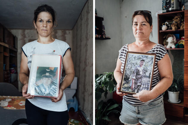 On the left, Oksana Burkan holds a portrait of her 25-year-old son, and on the right, Svitlana Kryvytska with a portrait of her husband Aleksander