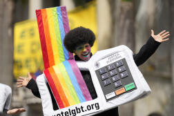 An LGBT activist dressed as an electronic voting machine at a demonstration at Sao Paulo University