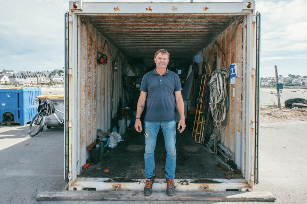 David Glidic, here in front of a storage room, manages the barge which makes the connection with the continent.  He is also a firefighter on the island of Batz (Finistère), July 28, 2022.