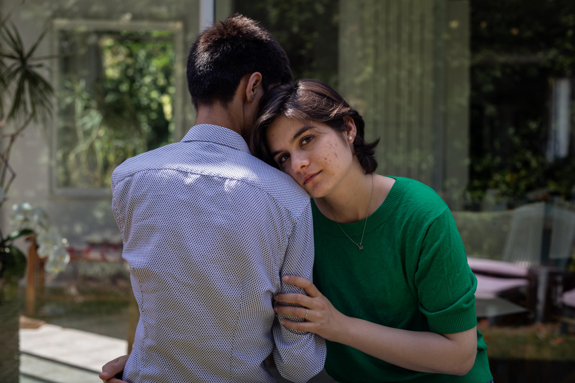 Tasnim Hakim and her husband, Ramin Mazhar, Afghan poet, in the garden of the house where they are staying in the Paris suburbs, June 25, 2022.