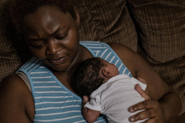 Kathy Dolley, 37, in Marsville, Mississippi, on July 13, 2022. Her newborn daughter has just been delivered prematurely by emergency C-section. This is her third living child out of six pregnancies.