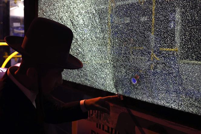 Israeli security inspects a bus that was the victim of a shooting, in Jerusalem, on August 14, 2022.
