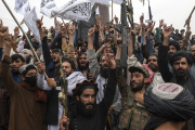 Taliban fighters celebrate the first anniversary of the fall of Kabul in Massoud Square on August 15
