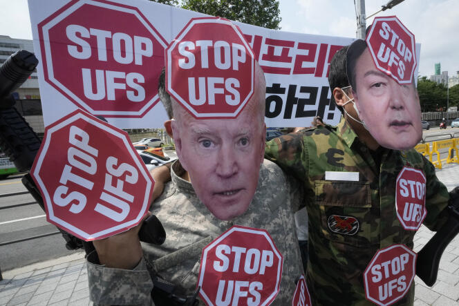 Protesters wearing masks of US President Joe Biden, left, and South Korean President Yoon Suk Yeol stage a rally to oppose planned joint military exercises, called the Ulchi Freedom Shield, between South Korea and the United States on the occasion of US House of Representatives Speaker Nancy Pelosi's visit in South Korea, in front of the presidential office in Seoul, South Korea August 4, 2022. 