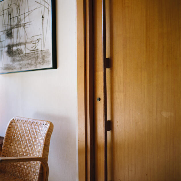 The living room door with its long nautical-inspired handle.