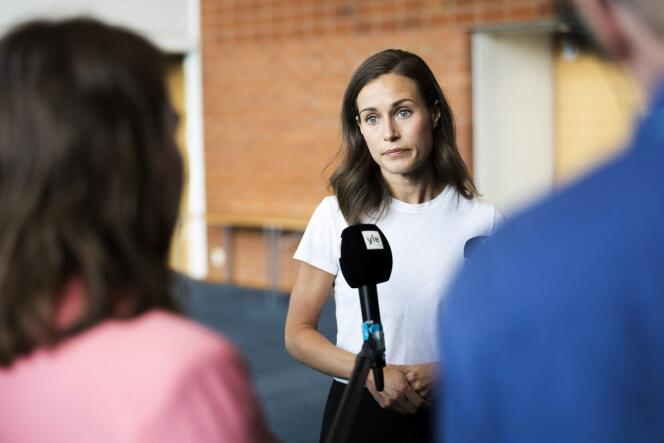 Finland's Prime Minister Sanna Marin speaks with members of the media in Kuopio, Finland August 18, 2022. 