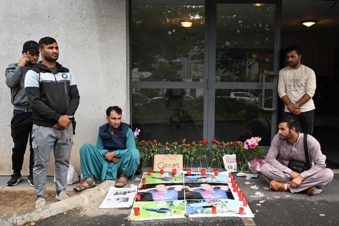 Relatives of Abdul Quayyem Ahmadzai gathered in front of the building where the young Afghan was killed a few days earlier, in Colmar, August 17, 2022. 