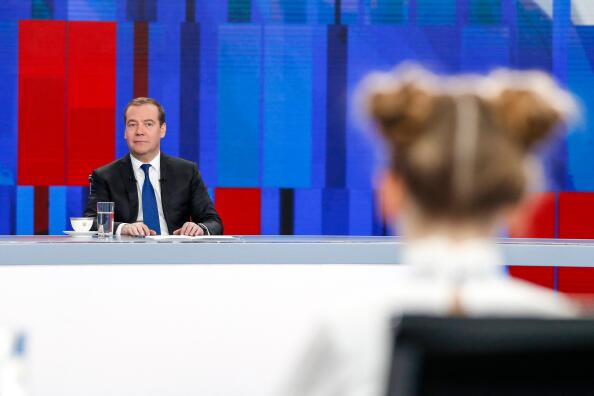 Russian Prime Minister Dmitry Medvedev gives a live interview on the annual results of the government work to journalists of Russia's television channels in Moscow on December 5, 2019. (Photo by Dmitry Astakhov / SPUTNIK / AFP)