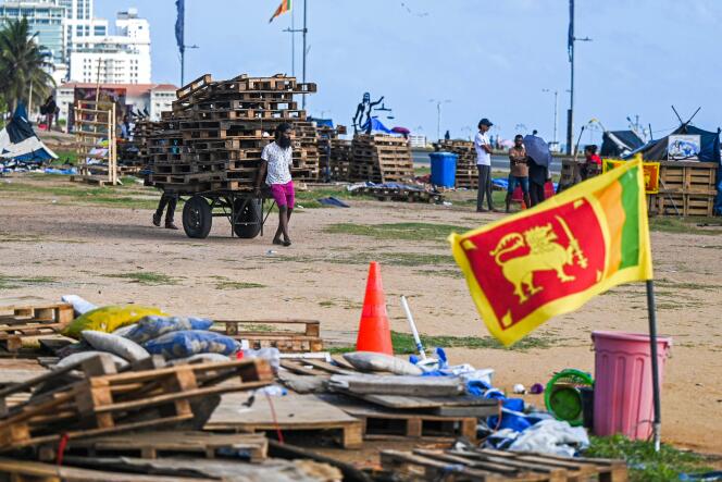 Demonstrators leave the site of an anti-government protest camp in Colombo, August 10, 2022.