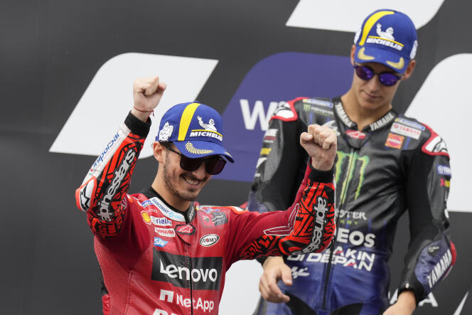 At the Austrian Grand Prix on August 21, 2022, Italian Francesco Bagnaia celebrates his victory in front of Frenchman Fabio Quartararo.