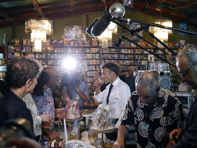 Emmanuel Macron drinks tea inside Disco Maghreb, the mythical label of rai music, on August 27, 2022. 