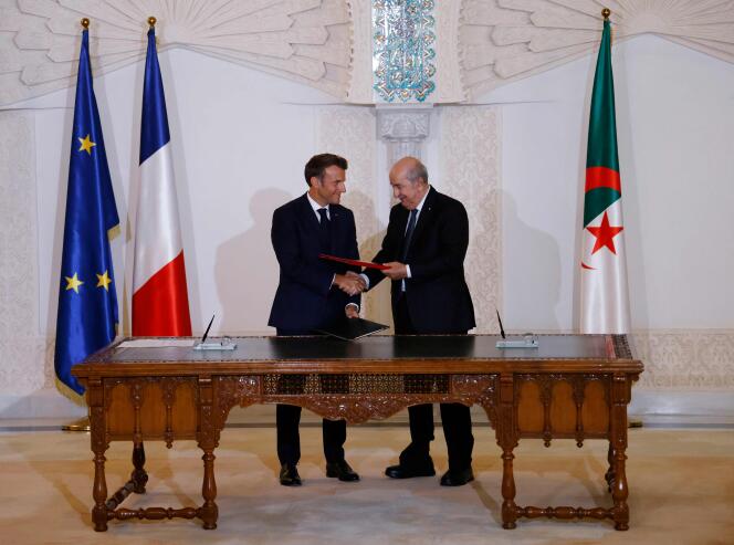 French President Emmanuel Macron and his Algerian counterpart Abdelmadjid Tebboune sign a joint declaration for a 