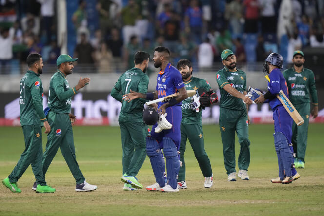 Indian and Pakistani cricketers greet each other after a match in Dubai on August 28, 2022.