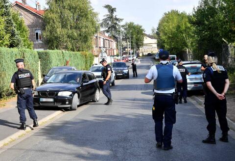 Police officers control a car in a street where a house belongs to Iman Hassan Iquioussen's family, in Lourches, northern France, on August 30, 2022. The Conseil d'Etat (French Council of State) gave its green light on August 30, 2022 to the expulsion of the Iman Hassan Iquioussen decided by French Interior Minister Gerald Darmanin. (Photo by FRANCOIS LO PRESTI / AFP)