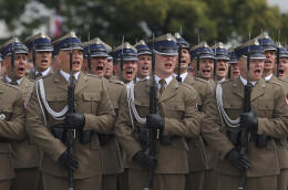 Polish troops sing national anthem during the ceremony marking Polish Army Day in Warsaw, Poland, Monday, Aug. 15, 2022. The Polish president and other officials marked their nation's Armed Forces Day holiday Monday alongside the U.S. army commander in Europe and regular American troops, a symbolic underlining of NATO support for members on the eastern front as Russia wages war nearby in Ukraine. (AP Photo/Michal Dyjuk)